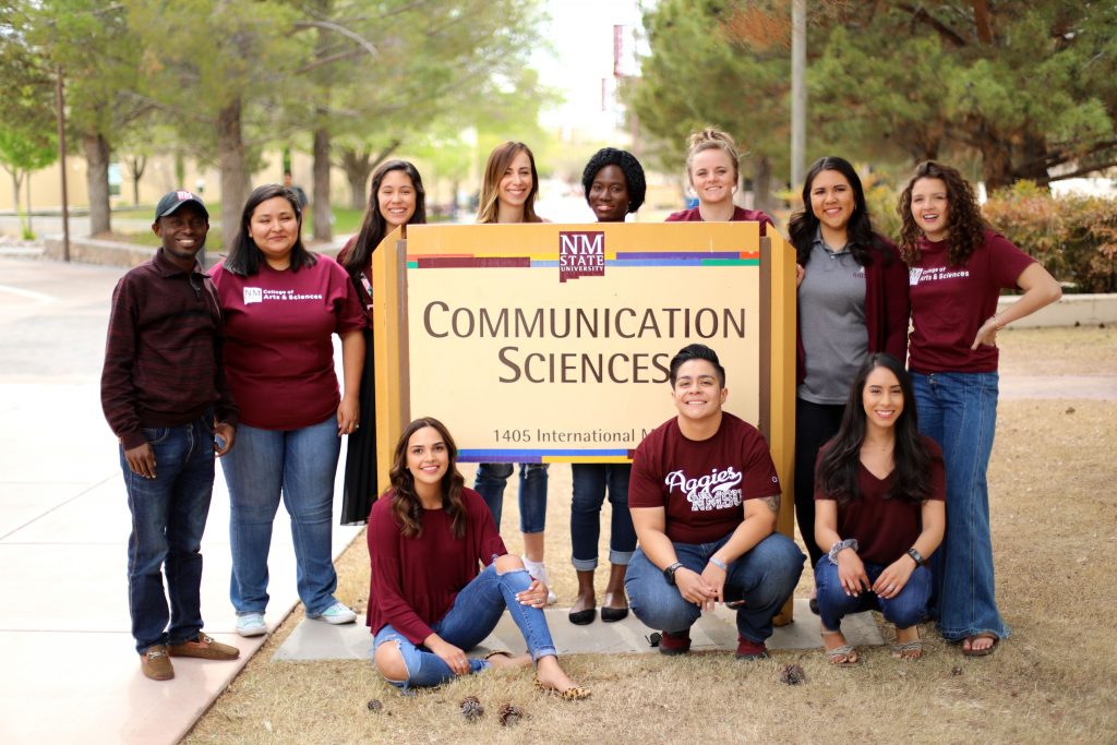 Group-with-comm-sciences-sign-1024x683.jpeg
