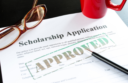 Scholarship image with application and the word approved across it